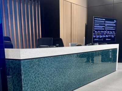 Office Reception Desk Recycled Glass with a bespoke green glass side panel