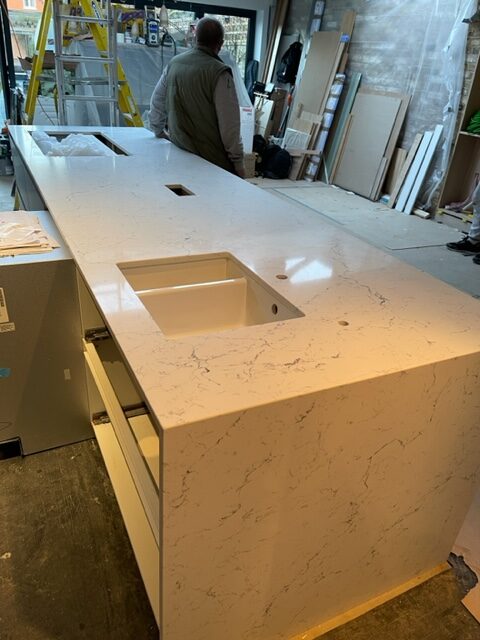 Completing installation of a Quartz Worktop