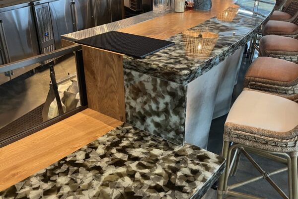 EcoGlass Bar Top in a restaurant Bespoke Eco Glass bar top made from 100% recycled glass for hospitality interiors